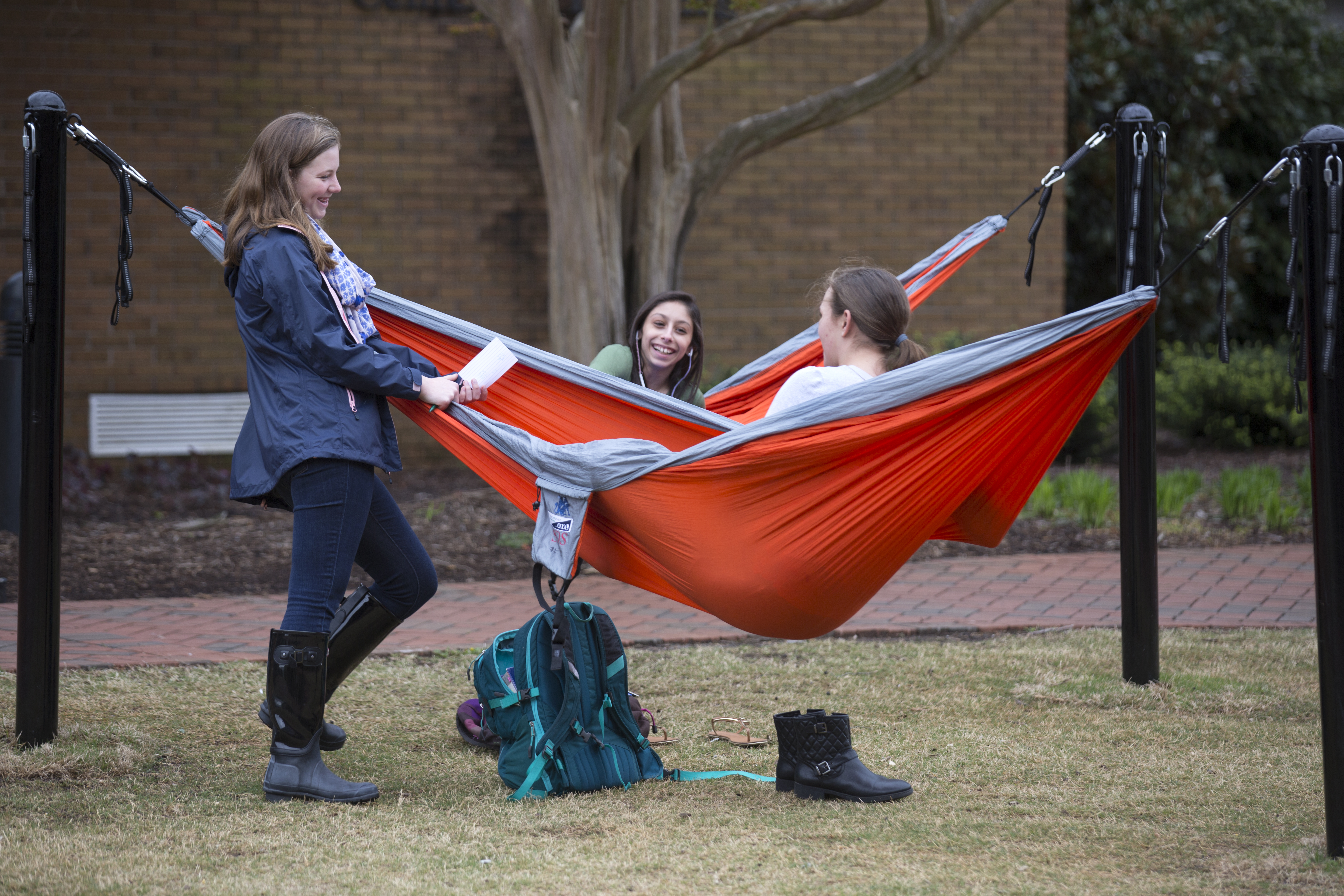SDS students lounging in hammocks